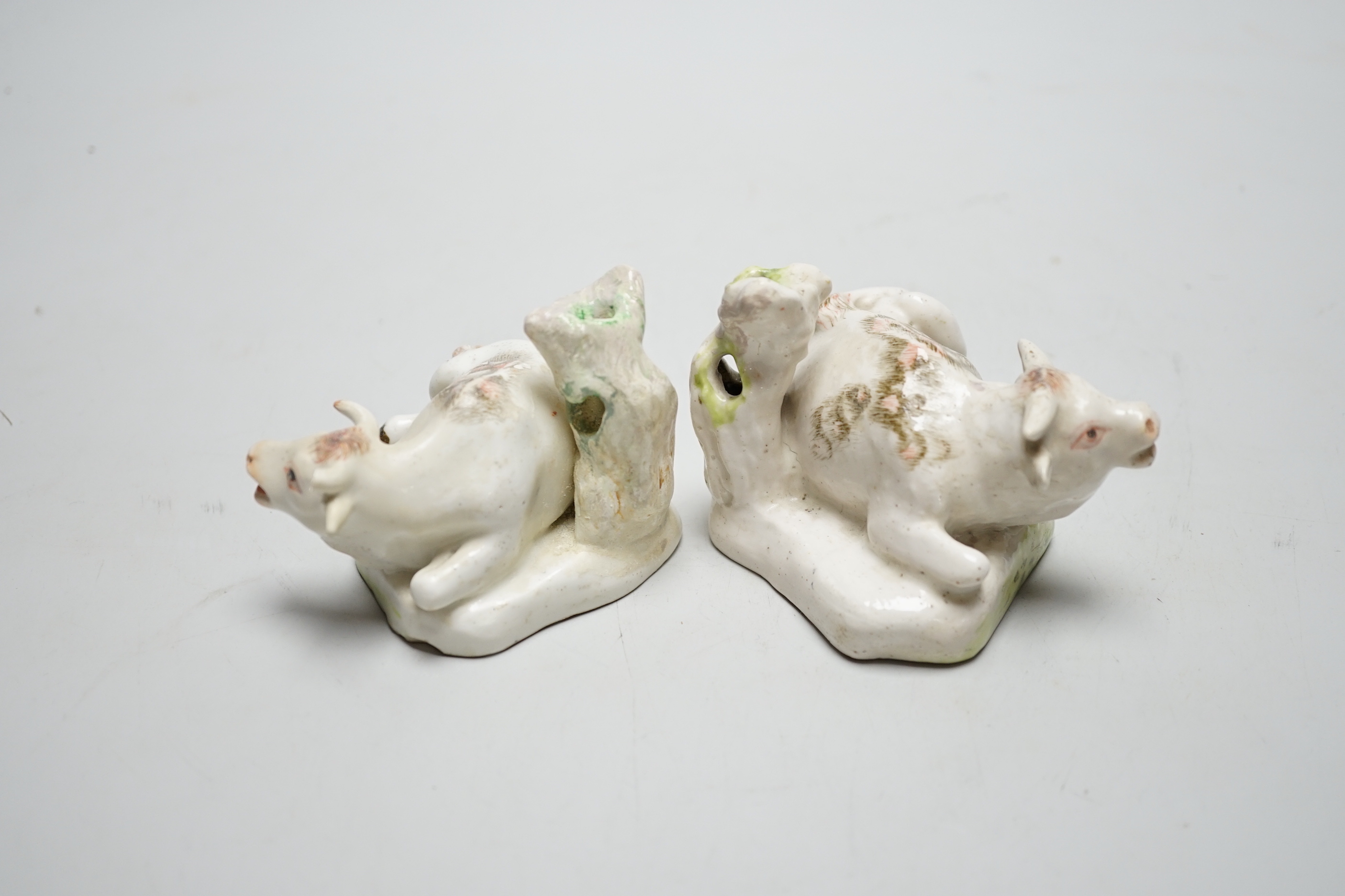 A pair of Derby figures of lowing cows, c.1760-5, 7cm tall